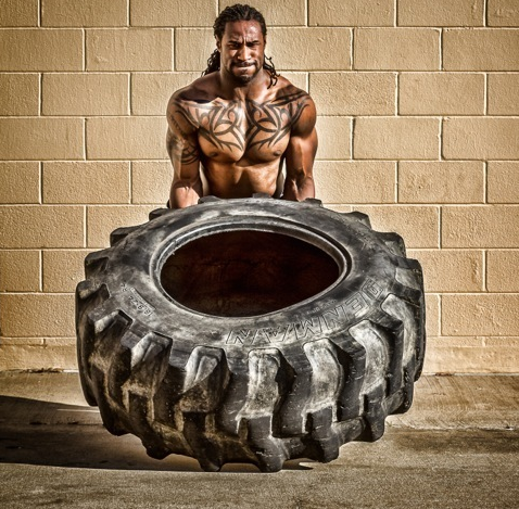 Isaiah Stanback flipping a tire during a workout, this is featured on the Steadfast website.