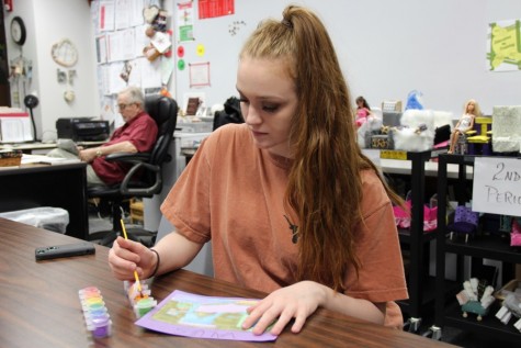 Coppell High School sophomore Sarah Wales paints different color schemes on a room in Beckey Richards’s interior design class on March 9. Wales interns for a local interior designer in hopes of becoming one after she graduates college along with being a professional dancer. 