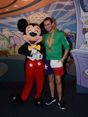 Coppell High School AP Human Geography teacher Ryan Simpson poses with Mickey Mouse during his time at Disney World. This past January, Simpson participated in the “Dopey Challenge” that takes runners from all over the world on a 48.6 mile tour of Disney World. Photo courtesy by Ryan Simpson.