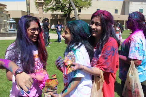 Seniors Aditi Mukund, Sneha Karkala and Veena Suthendran celebrate Holi by throwing colors on each other. Holi is celebrated with a lot of energy with colors, which represent the shades of emotions in life. Photo by Alexandra Dalton.