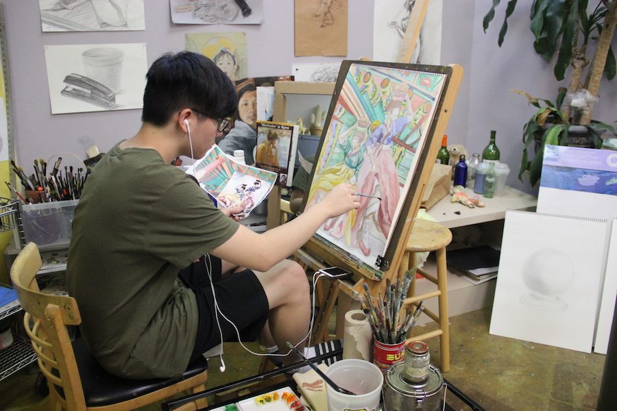 Coppell High School senior Chulmin Han carefully finishes one of his 17 art pieces on Friday at the Top Art Studio in Carrollton. He will then turn in his completed art pieces to apply to his dream art school-Rhode Island School of Design.