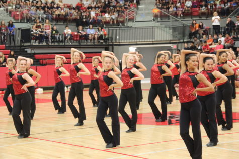Coppell High School Lariettes perform a dance routine during the pep rally on Friday morning. Students engage in pep rally activities and cheer on the girls on in preparation for the football game against Allen. 
