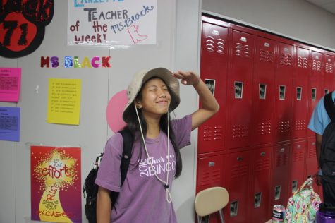 Coppell High School sophomore Sydney Nguyen laughs while showing off her wide brimmed hat as her costume for Safari Theme Day at Coppell High School on Wednesday for Red Ribbon week. Each day this week has a slogan and a dress up theme to encourage the prevention and awareness of drugs. Photo by Hannah Tucker.