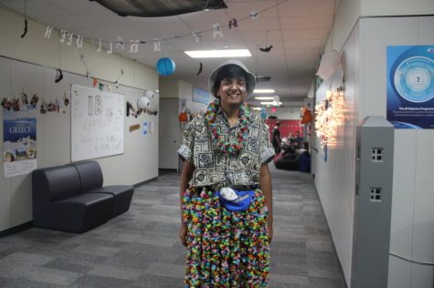Coppell High School junior Surya Ramakrishnan makes a scene in his floral skirt and shirt, accessorized with a fishing hat, sunscreen streaks and fanny pack on Thursday at Coppell for Tacky Tourist day. Each day this week there has been a theme and quote encouraging drug prevention for Red Ribbon Week. Photo by Hannah Tucker.