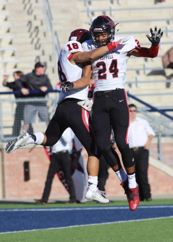 Senior wide receiver Matt Dorrity celebrates with junior wide receiver Gabe Lemons after one of Dorrity's two scores in Coppells 29-25 defeat of Rockwall.  Coppell will play Round Rock at 2 p.m. on Saturday, Nov. 26 in Waco.