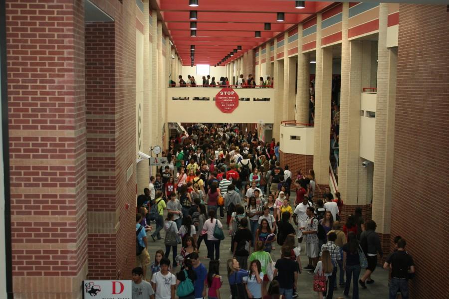 Overcrowding proves to be an issue at Coppell High School as students make their way to classes during passing period. 