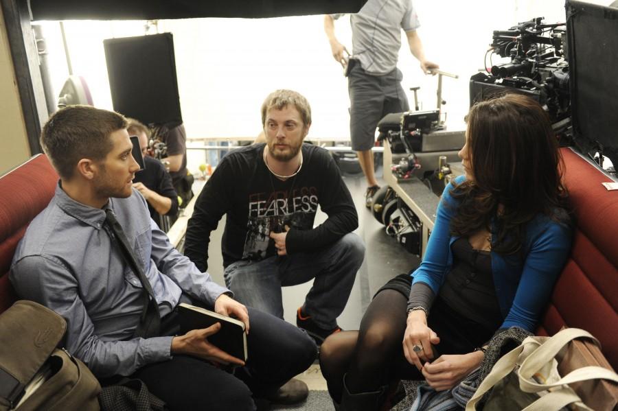 Jake Gyllenhaal, from left, director Duncan Jones and Michelle Monaghan talk on the set of Source Code. (Jonathan Wenk/Courtesy Summit Entertainment/MCT)