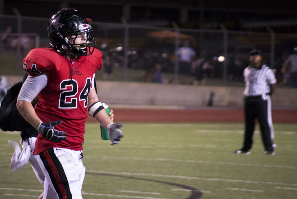 Junior running back Luke Jenner trots off the field against Arlington. Coppell won the game by the score of 38-24. Photo by Rowan Khazendar. 