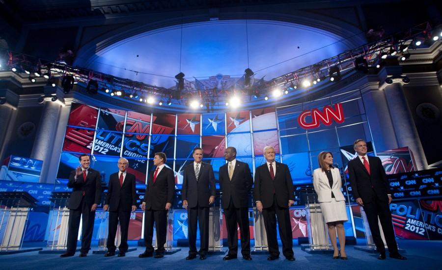 Rick Santorum, from left, Texas Rep. Ron Paul, Texas Governor Rick Perry, Mitt Romney, Herman Cain, Newt Gingrich, Minnesota Rep. Michele Bachmann and Jon Huntsman attend the Republican presidential debate at DAR Constitution Hall in Washington, D.C., Tuesday, November 22, 2011. (Olivier Douliery/Abaca Press/MCT)