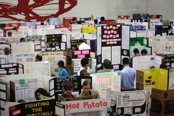 Coppell High School hosted the first Science Night at the Museum. The science fair projects of students were displayed throughout the small gym for guests to look at. Students had been working on their projects since the beginning of the first semester. Photo by Brian Hwu.