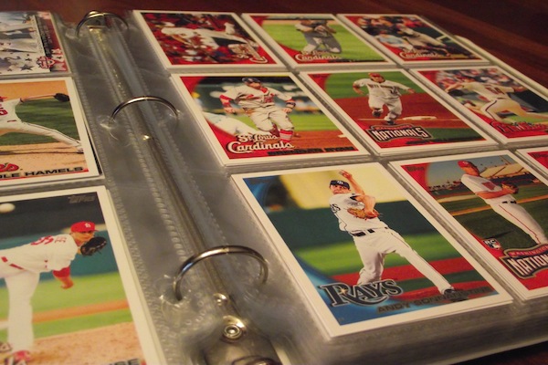 Numerous baseball cards are displayed in a binder. Collections such as these usually take many years to compile. Photo by John Loop