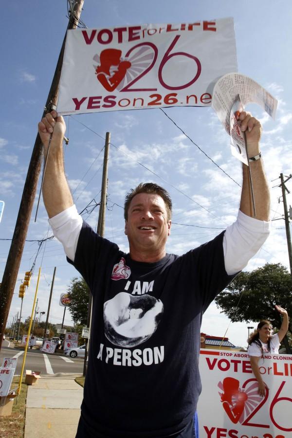 David Cupstid of Columbia, Miss., holds a sign in favor of Prop 26 Personhood Amendment at the corner of Popps Ferry and Pass Road in Biloxi, Mississippi on Tuesday, November 8, 2011. Voters defeated the Prop 26 Amendment. (Tim Isbell/Biloxi Sun Herald/MCT)