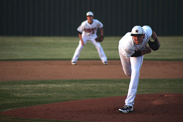 Junior pitcher Jake Elliot hurls the ball towards the plate. Elliott chalked up 10 strikeouts and earned the victory against the Indians. Photo by Brian Hwu.