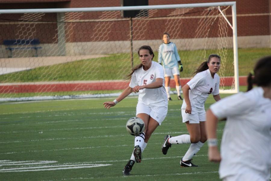 Senior, Lindsey Meyer, kicks the ball towards the goal. Photo by Davis DeLoach