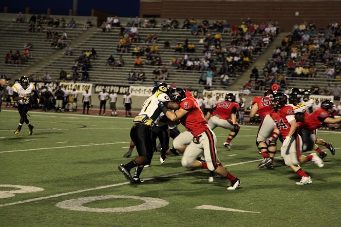 At the recent game against Garland Owls, Coppells  defense gears up to improve during this football season. Photo by Rowan Khazendar.