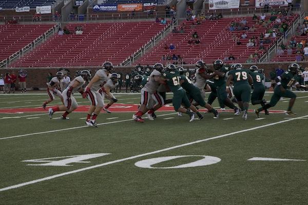 Coppell Cowboys successfully play defense against the Longview Lobos. Photo by Mia Ford.