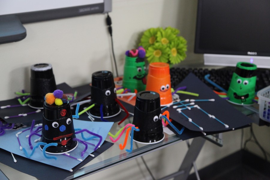 A group of spiders lurk on the table in the Ready Set Teach! room, ready to be gifted to staff and administrators. Photo by Kimberly Del Angel. 
