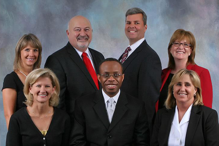 Amy Dungan (front row, far right) poses with fellow school board members.