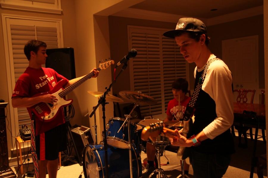 Coleman Loose (left), Daniel Jones (middle), and Christian Meyer (right) practice songs together in preparation for Relay for Life.