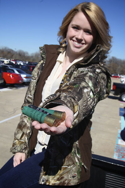 Senior Julie Miller sports a jacket similar to the ones that will be used by the sporting clay club. Photo by Rachel Bush.