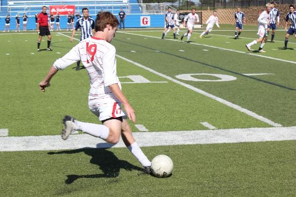 Junior Chis Madden crosses the ball in hopes of getting it to another teammate in Fridays 2-0 victory over Kingwood in Georgetown during the Class 5A semifinal match. Coppell faces Brownsvile Hanna at 6 p.m. Saturday for the Class 5A championship. Photo by Davis DeLoach.