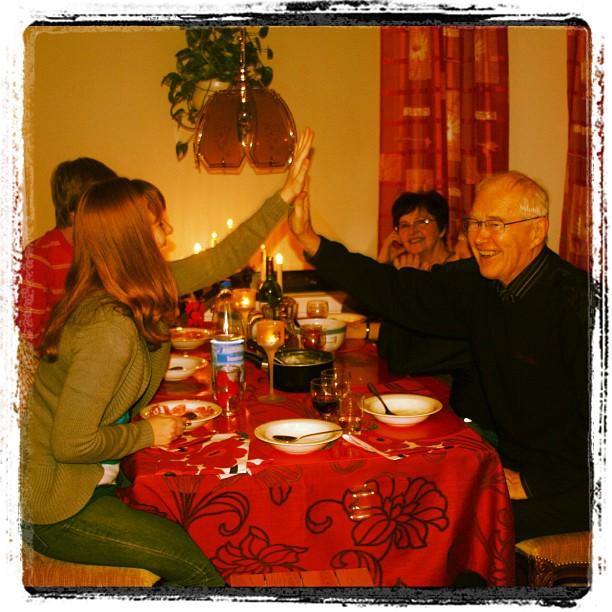 Me and my grandfather recreating our high five with my grandma looking on from the back during our Christmas feast on Christmas Even in 2010 at my grandparents home in Oulu, Finland. 