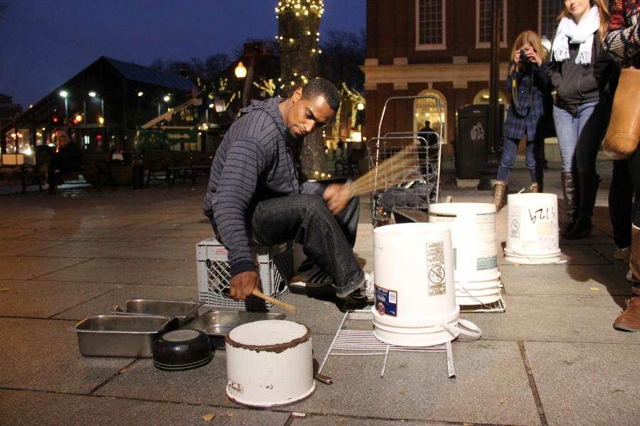 Jermaine Carter performs in front of Faneuil Hall in Boston on Thursday evening to entertain pedestrians. Thirty-one representatives from The Sidekick, Round-Up and KCBY are in the city attending the JEA/NSPA Fall National High School Journalism Convention. Photo by Sandy Iyer.