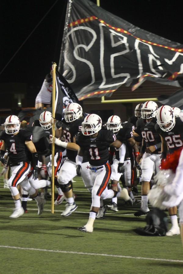 Cowboys make a grand entrance for district game. 