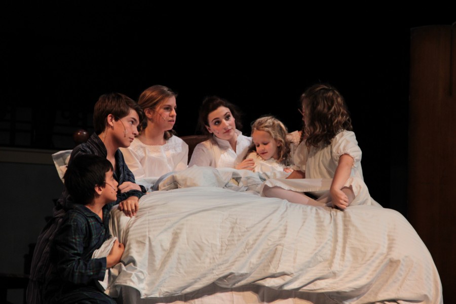 In The Sound of Music, Scene 7: Maria and The Von Trapp Children together in the Governess bedroom as Maria tries to calm the children from the fierce thunderstorm. Photo by Mark Slette.