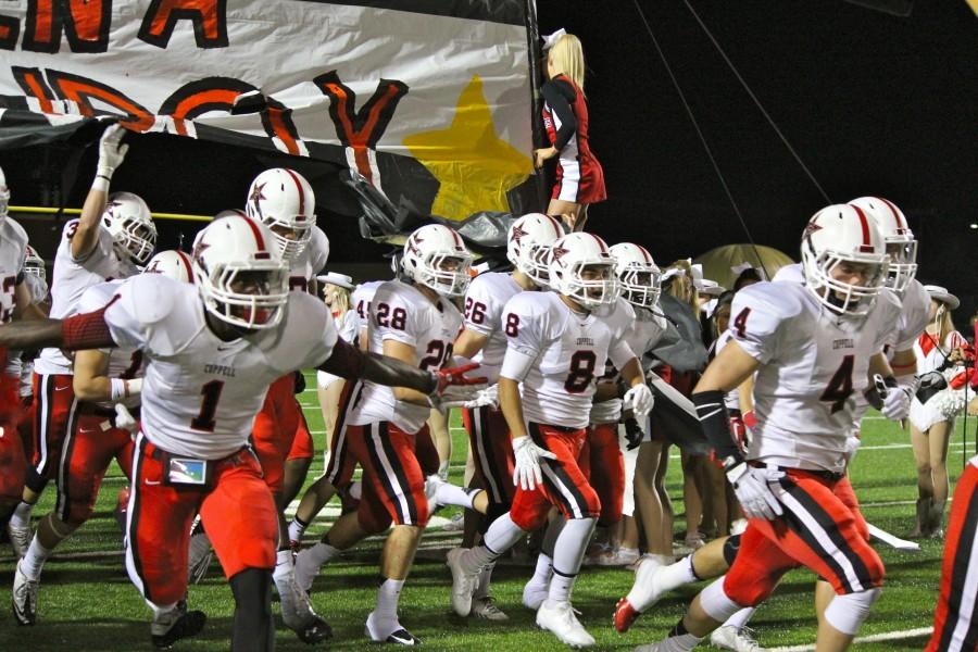 The Cowboys take the field before their game against the Irving Tigers at Irving Schools Stadium. Coppell defeated the Tigers, 56-8. Photo by Regan Sullivan.
