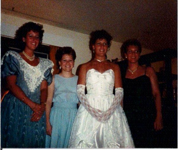 Meghan Ciganik (white) attends her 1987 prom wearing the dress that was eventually passed down to her daughter Melanie Talmadge . 