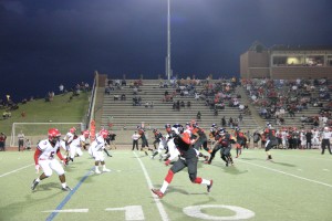 Senior running back Charles West sprints down the field at the start of a play in the second quarter against Cedar Hill. West was complemented well with Brandon Rice in his first game back.