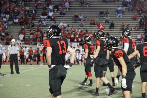 The Cowboys defensive unit lines up before the play during last weeks game against Cedar Hill. The defense allowed 559 total yards in the game on Friday.