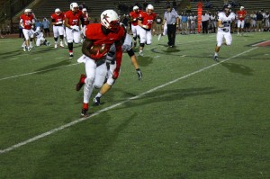 Senior running back Charles West sprints past a defender on his way to the end zone on the first Coppell offensive play. This play put Coppell up 14-3 with 2:17 left in the first quarter. Photo by Stephanie Alexander