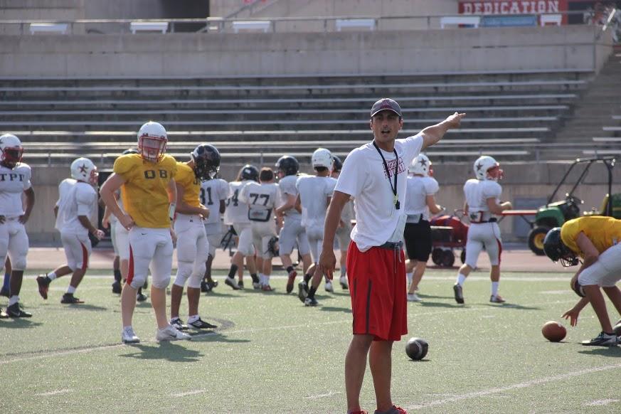 Coach Blackwell instructing players on the field at practice on Monday, Sept. 29. Photo by Chelsea Banks. 