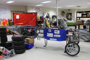 The Coppell High School solar car, which was raced over the summer, stays in STEM coordinator Mike Yakubovsky’s room, while STEM members works on improving it for the team’s next race. Photo by Kelly 