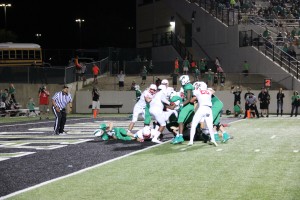 A Southlake running back dives into the end zone for a touchdown in Friday night's game. The Southlake offense had 33 rushes for 168 yards against Coppell. Photo by Mallorie Munoz.