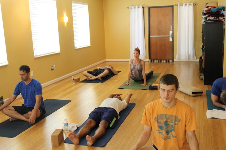 Yoga class attendees breathe and stretch before morning class on Oct. 25. Photo by Stephanie Alexander. 