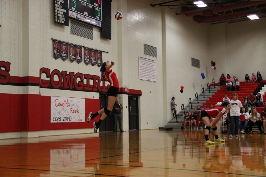 Coppell senior setter Kylie Pickrell jumps to serve on Tuesday night against Colleyville Heritage. Coppell returns to District 7-6A play tonight at home against Richland. Photo by Aubrie Sisk