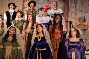 Performers wrap up the Madrigals Feast with one last song before the alumni come up from the audience and perform on Nov. 22, in the CHS large commins. Photo by Amanda Hair. 