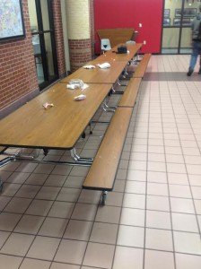 Students eating in the cafeteria during lunch leave behind trash which the janitors have to pick up. The janitors have a maximum of five minutes between each lunch to completely clean and wipe every table. Photo by Chelsea Banks.