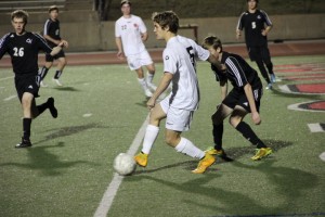 Forward Tanner Traw steals the ball from the Panthers, getting an advantage against Heritage at Friday night's game at Coppell High School. Photo by Amanda Hair.