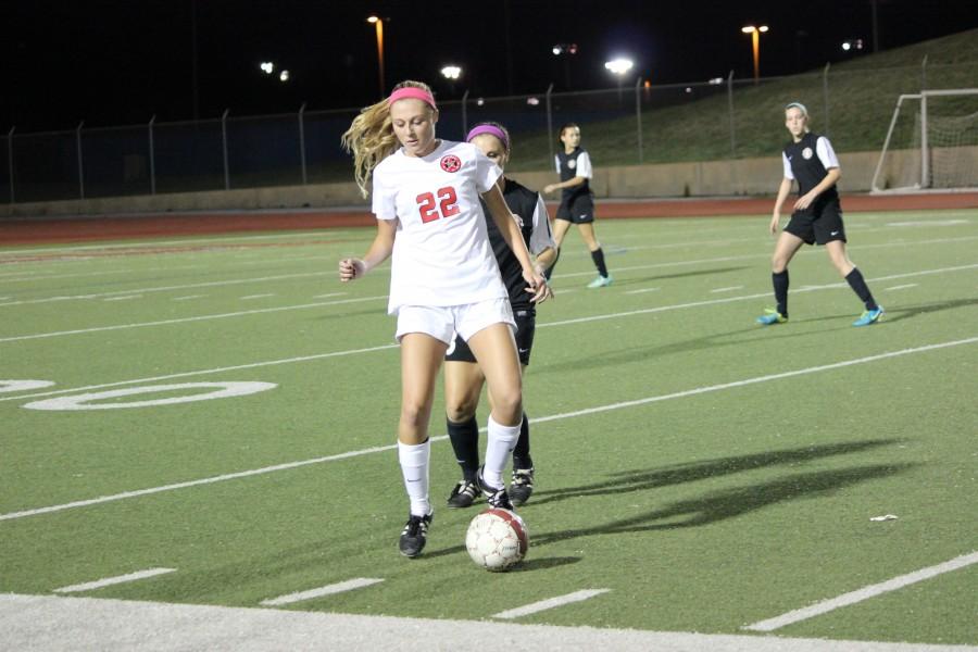 Senior Tara Vishnesky controls the ball in front of a Colleyville player on Wednesday. Vishnesky scored for the Cowgirls on her senior night. Photo buy Kelly Monaghan.