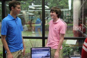 Juniors Stjepan Kilic and Drew Tucker practice explaining their project over music piracy, while in the  library during second period on Thursday. Photo by Kelly Monaghan. 