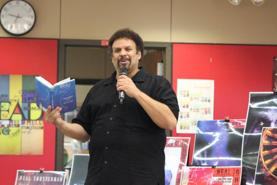 Author+Neal+Shusterman+reads+a+paragraph+of+his+new+release+Challenge+Deep+to+describe+his+creative+process+to+students.+Photo+by+Kelly+Monaghan.