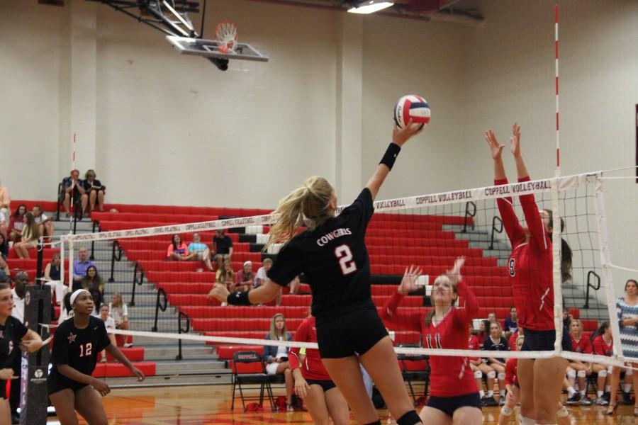 Senior+right+side+Kylie+Hagen-Breitenwischer+tips+the+ball+over+the+net+Friday+night+against+Grapevine.+The+Coppell+Cowgirls+played+the+Grapevine+Mustangs+in+three+matches+and+won+all+of+them.+Photo+by+Maggie+Theel.