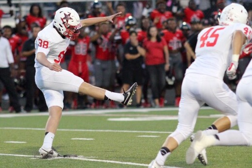 Coppell High School senior kicker Tyler Smith starts off the game versus Cedar Hill on Friday night. The Cedar Hill Longhorns pulled out a 36-21 victory over Coppell. Photo by Amanda Hair.