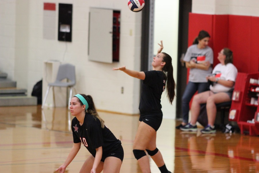 Senior setter Maddie Hood serves the ball to the LD Bell Blue Raiders in the second game of the match. The Cowgirls won the game 25-11 and the match 3-0. Photo by Amanda Hair.