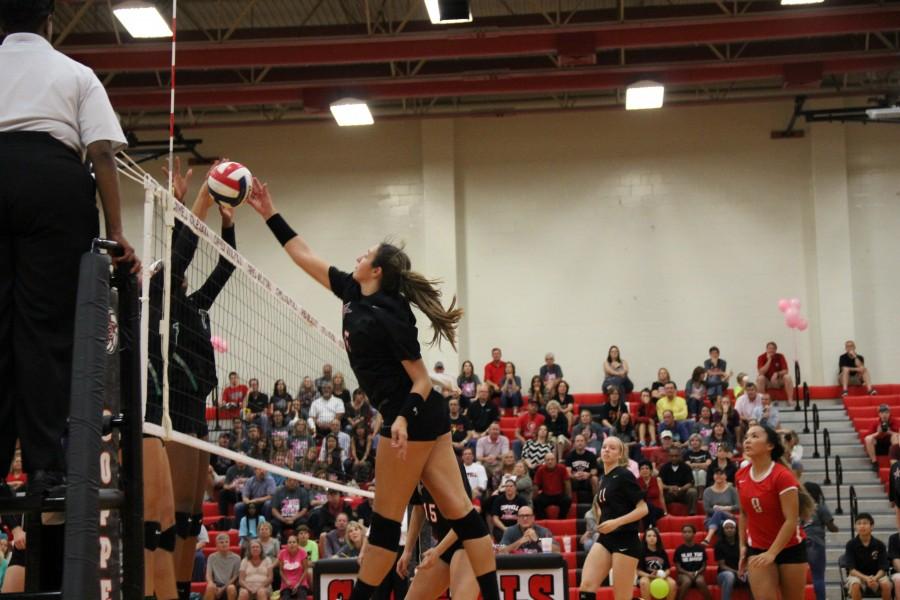 Coppell High School senior outside hitter Jamie Stivers tips the ball over the net to Southlake Friday night in the CHS gym. Coppell played the number one ranked team in district, and fell behind making them ranked number two. Photo by Aubrie Sisk.
