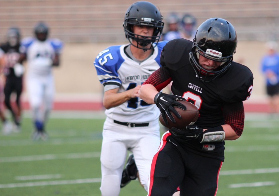 Coppell Cowboys JV Red tight end Connor Salerno runs 25 yards after a 20 yard pass to score the first Cowboy touchdown Aug. 27 at Buddy Echols Field to help the Cowboys win 27-13 over Hebron.
